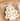 Mini Gingerbread Ornament set (6 assorted, 2-inch) by Raz with white icing on brown cookies in a cardboard tray
