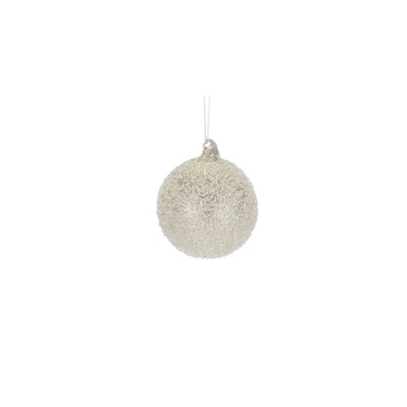 Glass champagne frosted ornament with silver hanging string and glitter texture.