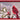Wood cardinal wall art in a red frame; red cardinal on snowy holly branches.