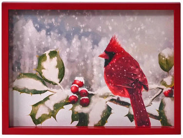 Wood cardinal wall art in a red frame; red cardinal on snowy holly branches.