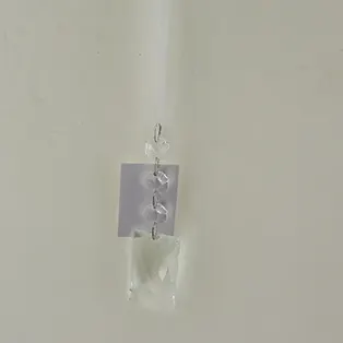 Small clear glass ornament by A&B; holiday ornament merchandise.