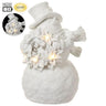 Lit snowman figurine by Allstate holding a wreath, white glitter, battery-operated lights, 7.75 in high.
