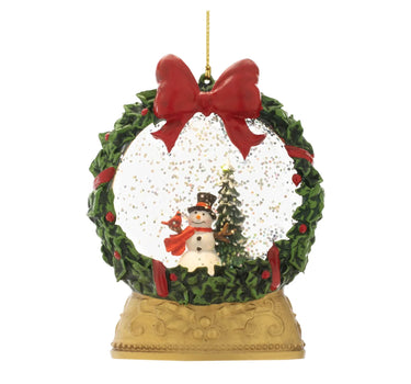 Melrose LED Snowman Globe Ornament, 5-inch, hanging on a gold string with red bow and green wreath