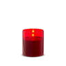 Red glass pillar candle in a red glass holder, 3.5x4 in, lit