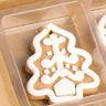 Mini Gingerbread Ornament set (6 assorted, 2-inch) by Raz with white icing on brown cookies in a cardboard tray