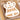 Raz Mini Gingerbread Ornament set, 6 assorted 2-inch ornaments with white icing in a cardboard tray.