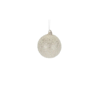 Glass champagne frosted ornament with silver hanging string and glitter texture.