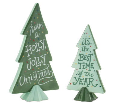 Two ceramic Christmas trees in green glaze, large and small, with festive white script and colorful confetti dots
