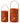 Metal cutout pumpkin can lanterns in two sizes, orange with handles, lit from inside.