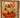Beaded orange pumpkin block by Special T in a wooden frame, featuring two pumpkins with green stems and autumn leaves.