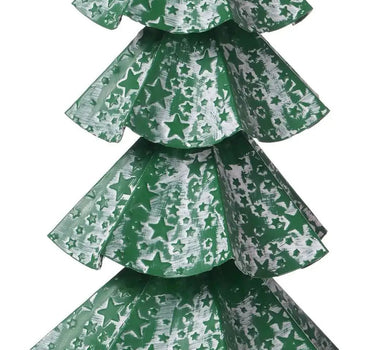 Small whitewash artificial Christmas tree with green star-patterned tiers and a star topper on a green pedestal.