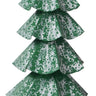 Small whitewash artificial Christmas tree with green star-patterned tiers and a star topper on a green pedestal.