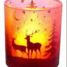 Glass deer candle holder by Special T, pink translucent glass with deer and tree silhouettes, candle glow inside