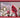 Wood cardinal wall art in a red frame; red cardinal on snowy holly branches.