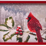 Wood cardinal wall art in a red frame; red cardinal on snowy holly branches.
