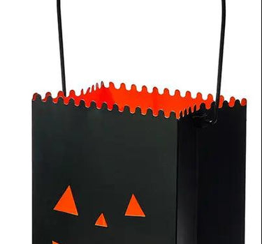 Metal jack-o-lantern container with handle; black exterior, orange interior glow, two sizes available.