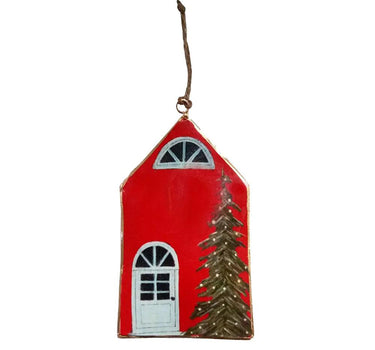 Red iron house ornament by A&B, 3.5x6 in, with hanging string, white door, arched window, and pine tree.